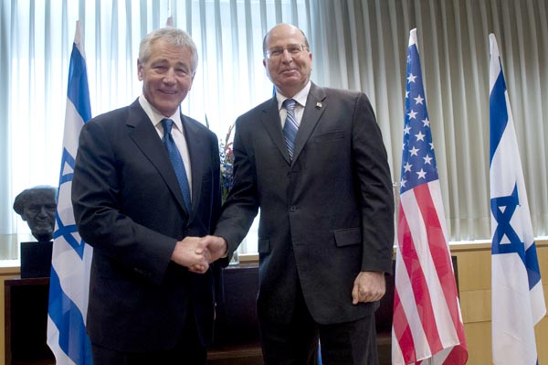 Secretary of Defense Chuck Hagel shakes hands with Israeli Minister of Defense.